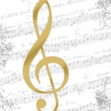 goldener Notenschlüssel vor einem Notenblatt - golden clef in front of a sheet of music - clé d or devant une feuille de musique